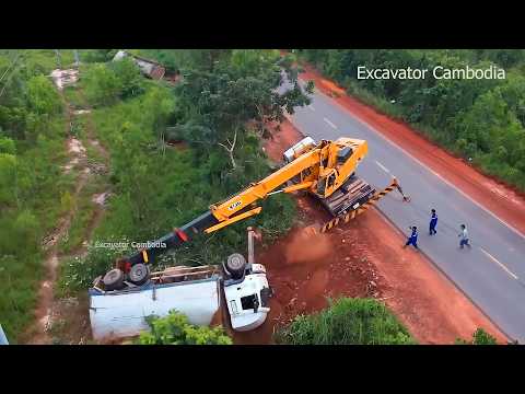 Be careful ! dump truck overturned on the national road recovery by experts crane success .