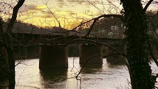 Harper s Ferry trains coming through mountain tunnel onto bridge - close up