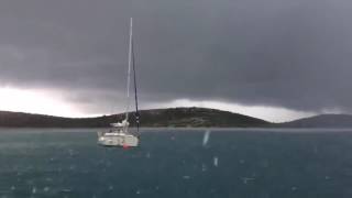Lightning strike close to yachts in sea