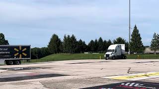 Walmart Trucks arriving BNLHS for parade to Walmart