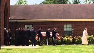 The casket of Sen. Howard H. Baker Jr. receives a military escort