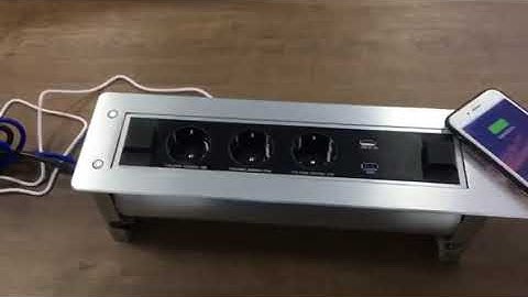 Motorized flip up power outlet socket