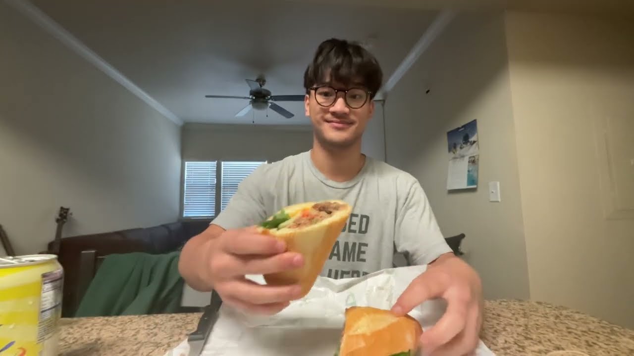 eating a bahn mi in two bites