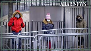 Coronavirus: People line up outside New York hospital to get tested