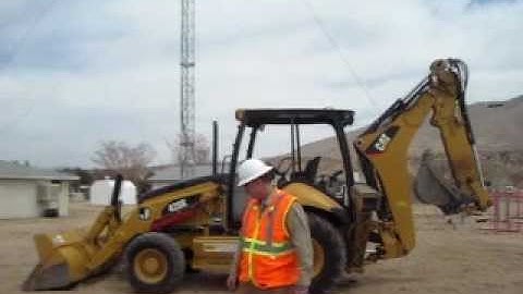 Michael Constantin demonstrating Start Up Procedures for a CAT Backhoe.
