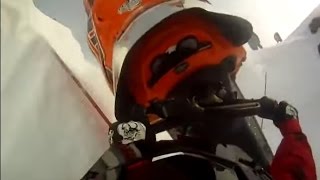 Snowmobile wipe out (On helmet cam) ! Sled wipes out at top of hill and rolls all the way back down!