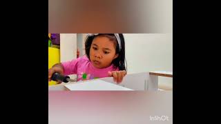 Qistina and a white drawer