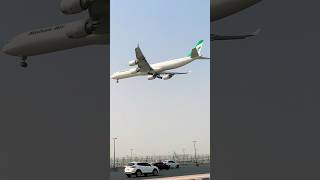 W World Mahan Air Landing Dubai International Airport