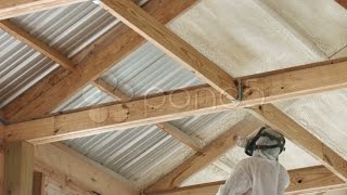 Technician Spraying Foam Insulation Into Ceiling Of A Building. Stock Footage