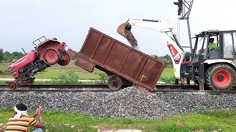 Mahindra yuvo tractor funny accident while working on railway track | Jcb rescued the tractor 🚜😃