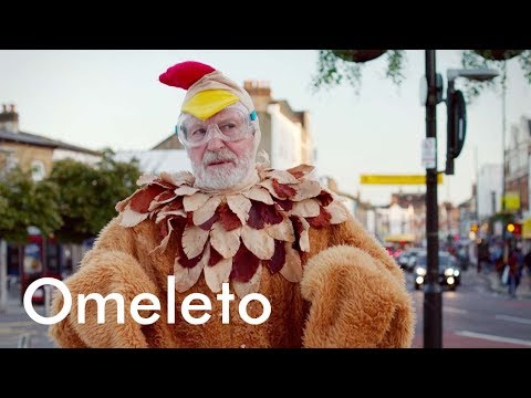 A man in a chicken suit invites people to throw eggs at him. Because he has a pl