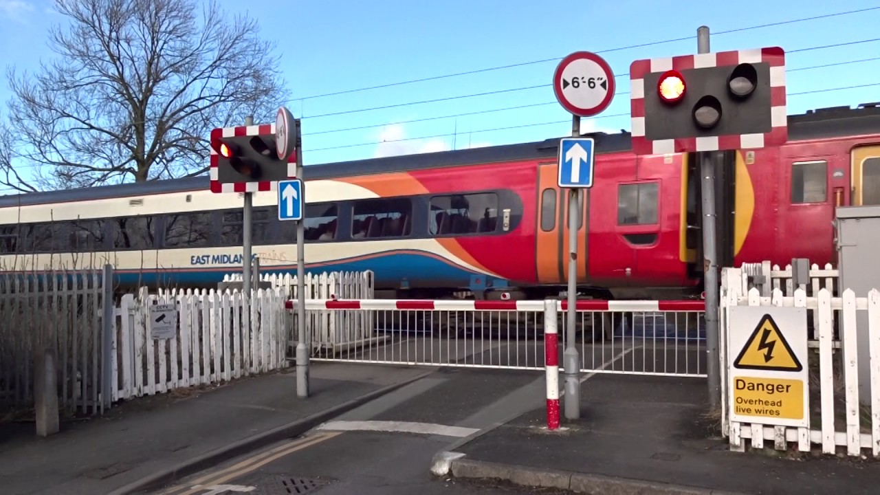 Class 158 passing through Woodsmoor Level Crossing in Stockport YouTube