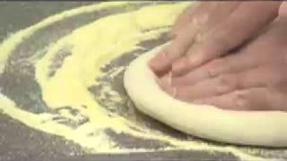 Garlic Jim's Famous Gourmet Pizza - Dough Slapping Instructional Video