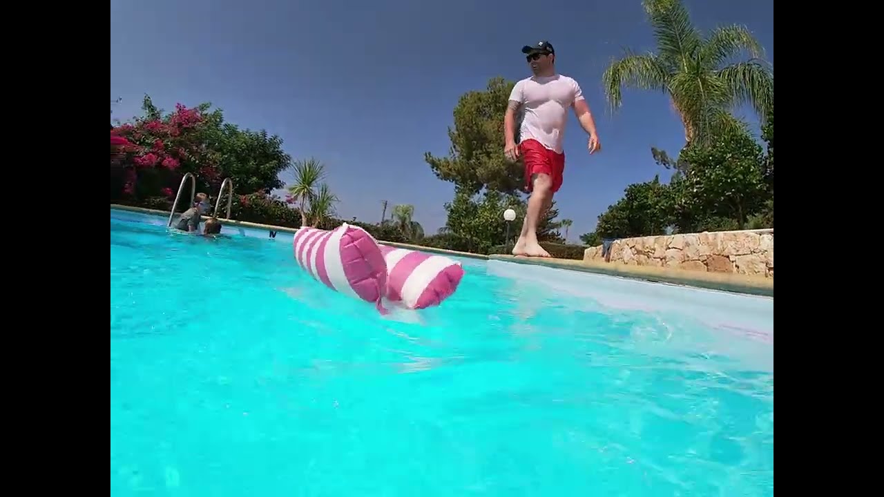 My dad trying to do aback flip in to the pool fail ￼
