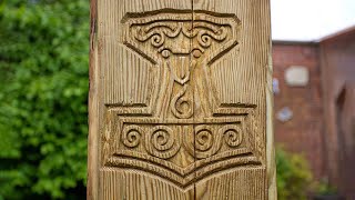 Carving Thor's Hammer into an old fence post...