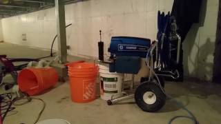 SPRAYING FIREPROOF PAINT ON THE FOAM INSULATION IN THE CRAWL SPACE