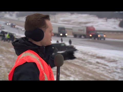 DFW ice storm: Trucks and jeeps help tow 18-wheelers that got stuck on ice along I-20. Unbelievable!