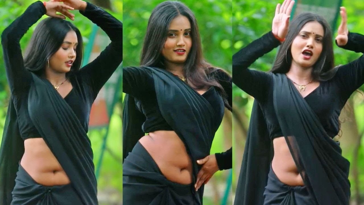 Saree Fashion Model Posing In Dark Green Chiffon Saree With Matching Black Full Sleeve Velvet Blouse