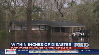 Bayou Sara flooding threatening homes