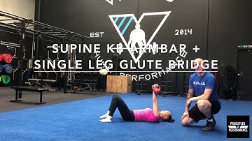 Supine Kettlebell Arm Bar + Single Leg Glute Bridge