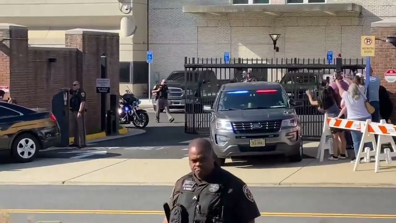 Johnny Depp waves to fellow captain Jack Sparrow while leaving court