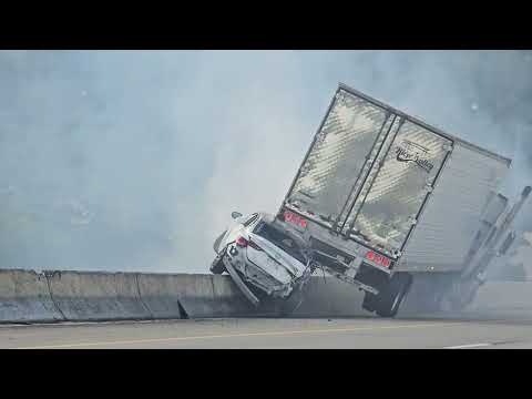 Truck drags SUV hanging off of a bridge! SUV driver escapes through sunroof!