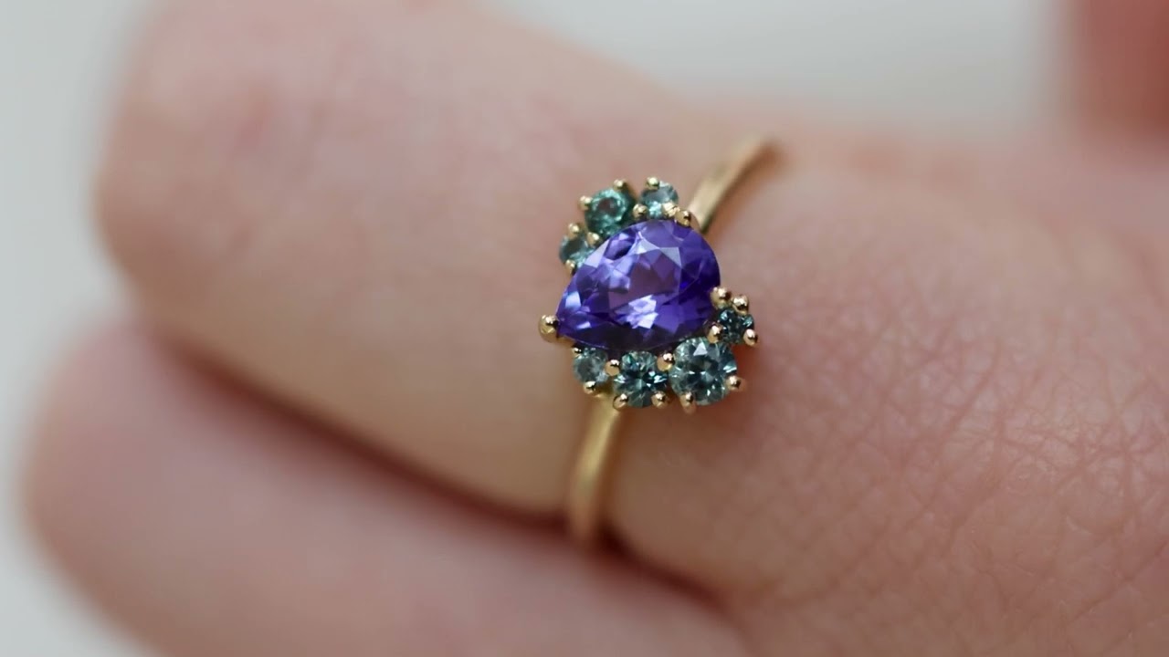Tanzanite cluster ring with teal sapphires