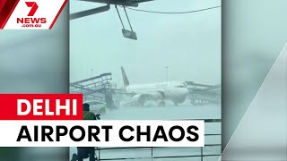 Staircase crashes into planes at Delhi airport | 7NEWS