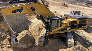 Caterpillar 385C Excavator Loading Trucks