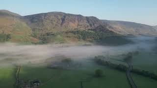 Borrowdale Valley Cumbria. Sunrise over the mountains and valley mist.