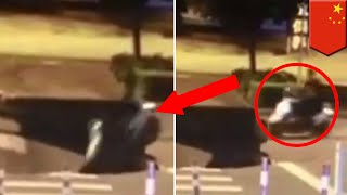 Caught on cam: Scooter rider busy on phone rides scooter straight into a giant sinkhole - TomoNews