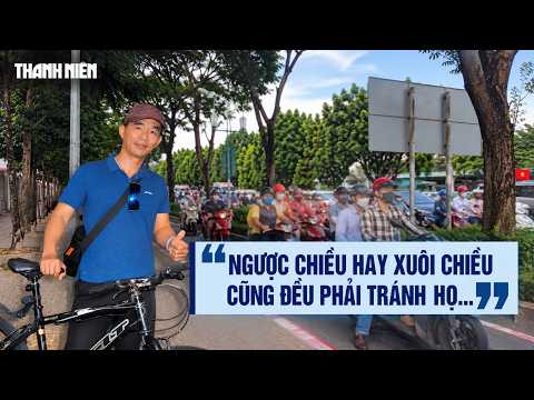 Motorcycles repeatedly encroach on bike lanes and travel in the wrong direction on Mai Chi Tho St...