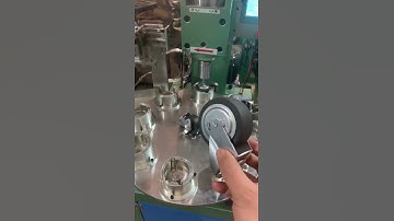 Automatic castor riveting machine