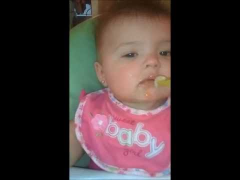 baby-funny-face-eating-apple-sauce