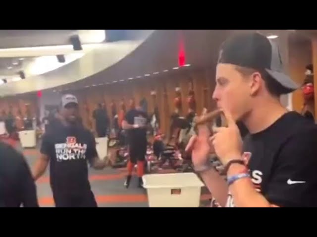 Joe burrow does the get the gat dance as he and his other Bengals teammates celebrate division win