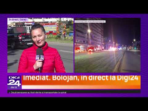 Digi24 reporter live in Galați beside night footage of emergency vehicles after the drone hit an apartment block.