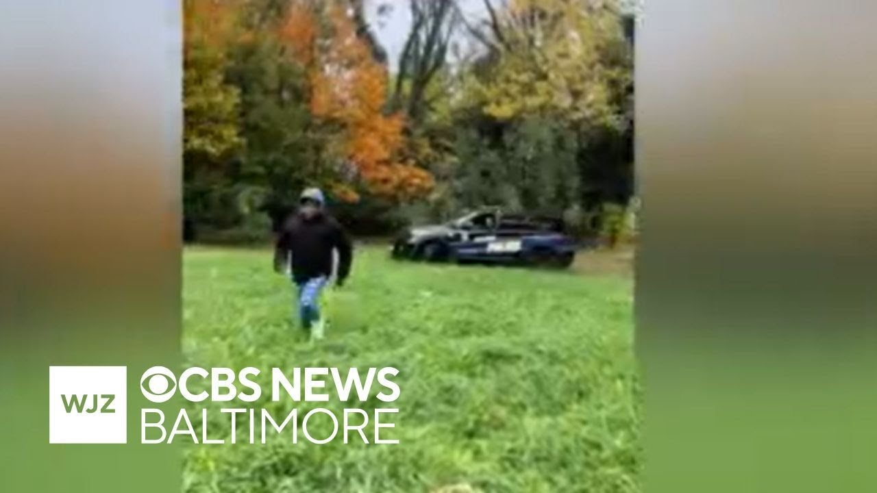 Viral video shows Baltimore police officer nearly running over person