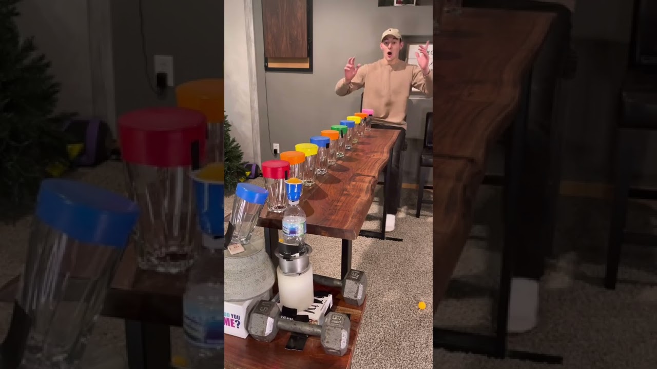 Guy Bounced Ping Pong Ball on Balloon Cups as a Water Bottle Slid across the Table