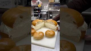 Schmearing a giant plain bagel 🥯 👀#bagels #foodie