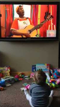 Eva engrossed in Balamory (age 11 months)