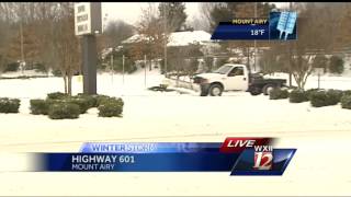 Snowfall in Mount Airy and slick road conditions