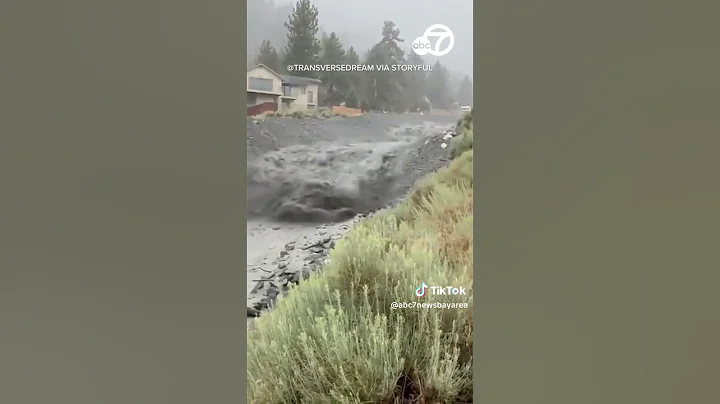 Locals watch as mud flows through CA canyon