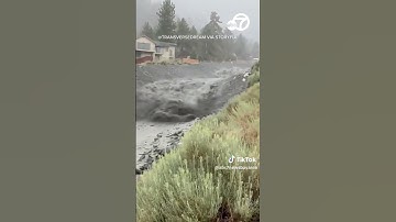 Locals watch as mud flows through CA canyon