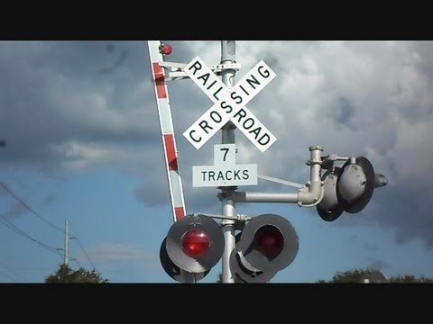 CSX Train Goes Through Railroad Crossing With 7 Tracks - YouTube