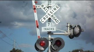 CSX Train Goes Through Railroad Crossing With 7 Tracks