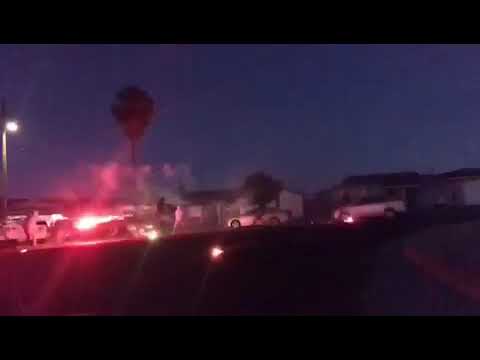 Hoodclips kids playing in street with red and green fire works
