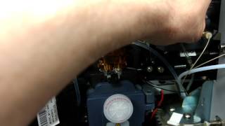 Changing the nozzle on a flow cytometer.