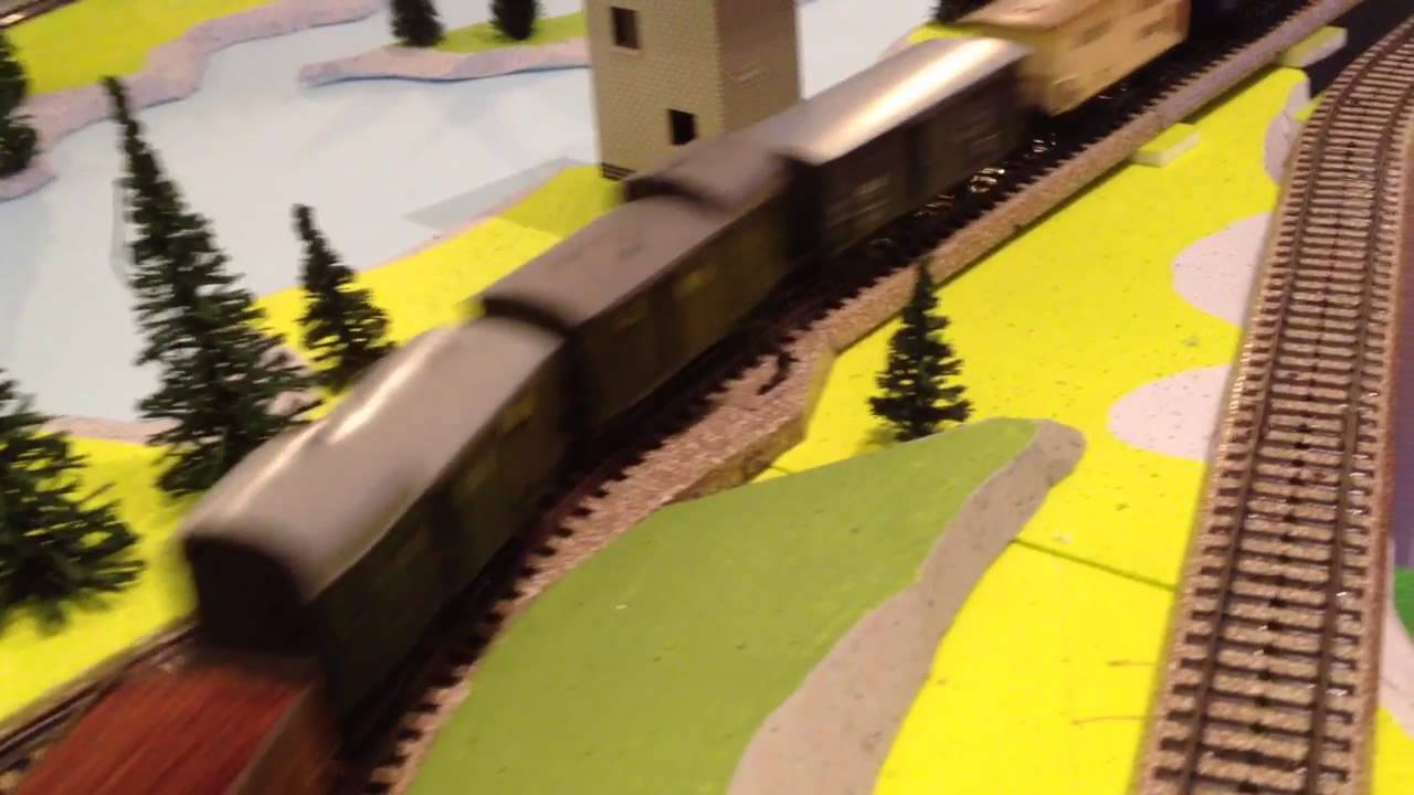 V140 first german diesel locomotive ahead of cargo railcars