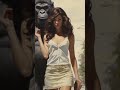 Pretty woman walking with a gorilla down my street
