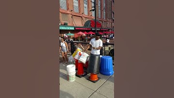 Man making  music with trash can